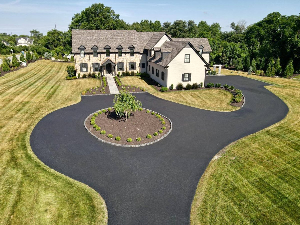 Aerial view of front of home driveway and walkway hardscaping and landscaping by First Class Lawn Care in Wilmington, DE