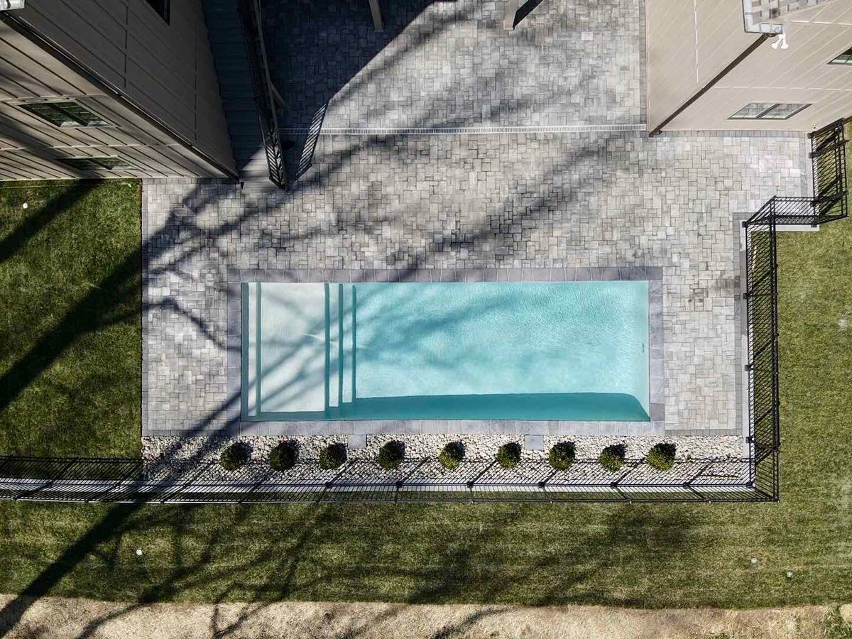 Aerial View Of Custom Inground Pool with Hardscaping by First Class Lawn Care