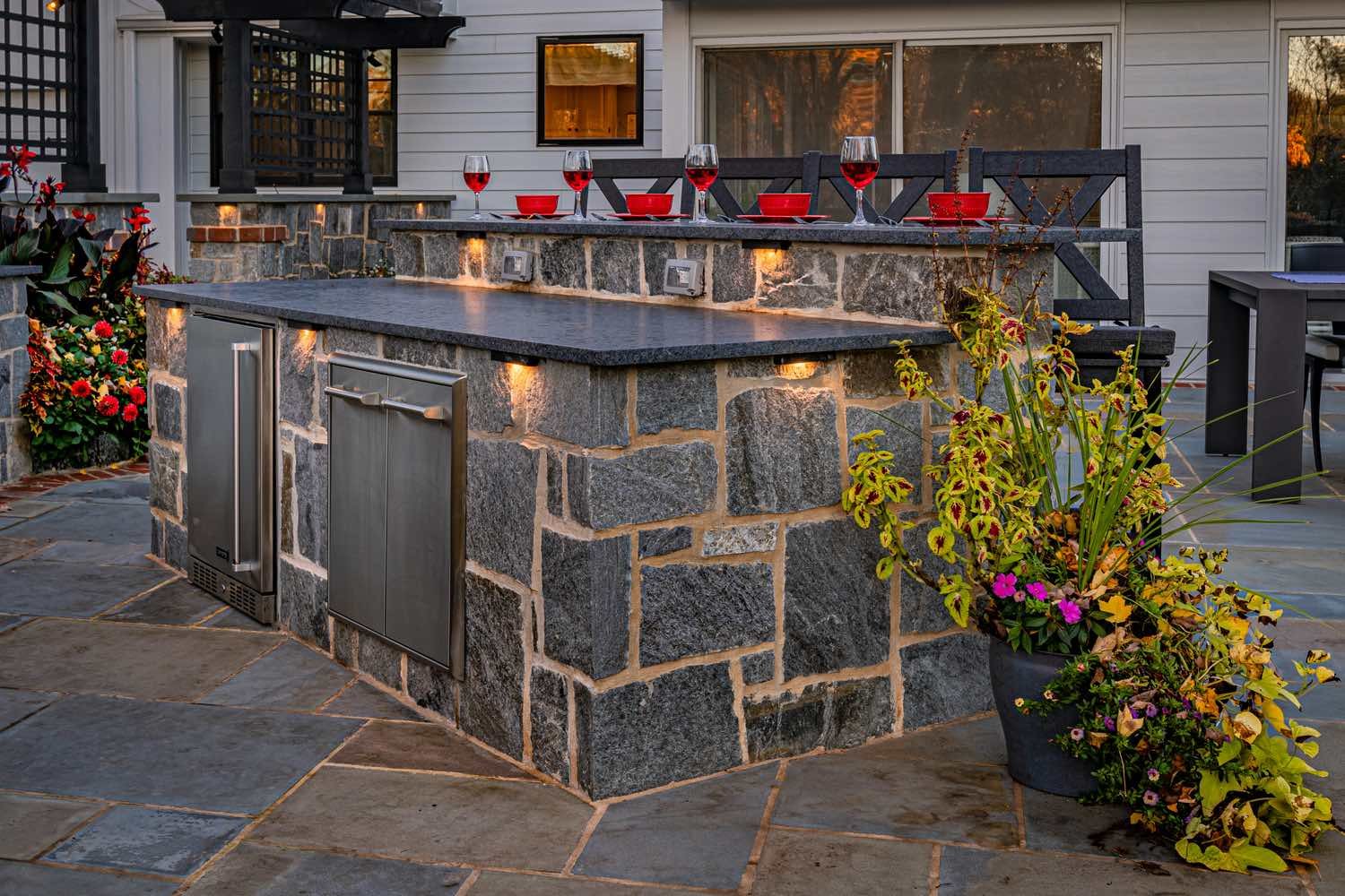 Custom Outdoor Kitchen With Island Seating by First Class Lawn Care