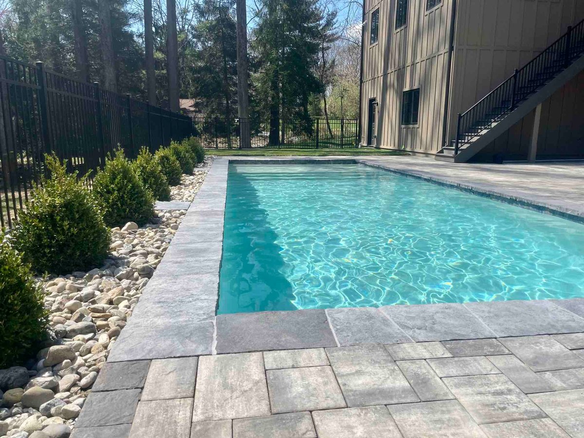 Inground Pool With Custom Landscaping and Hardscaping by First Class Lawn Care