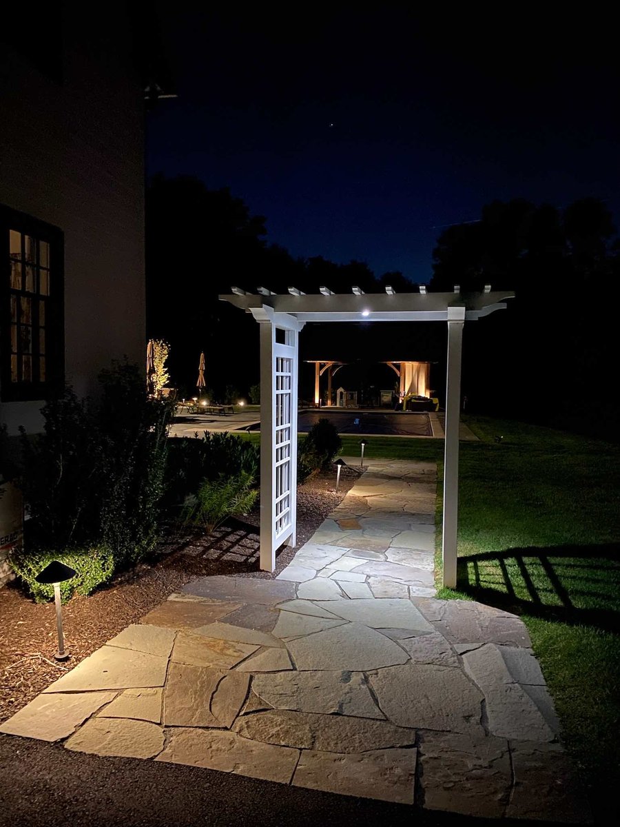 Night Time View Of Custom Walkway and Trellis By First Class Lawn Care