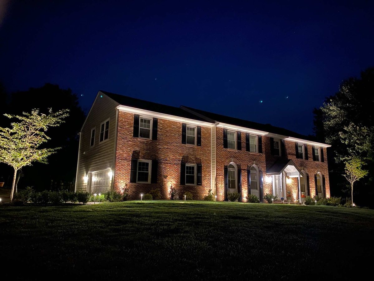 View of Front Lawn and House with Custom Lighting by First Class Lawn Care