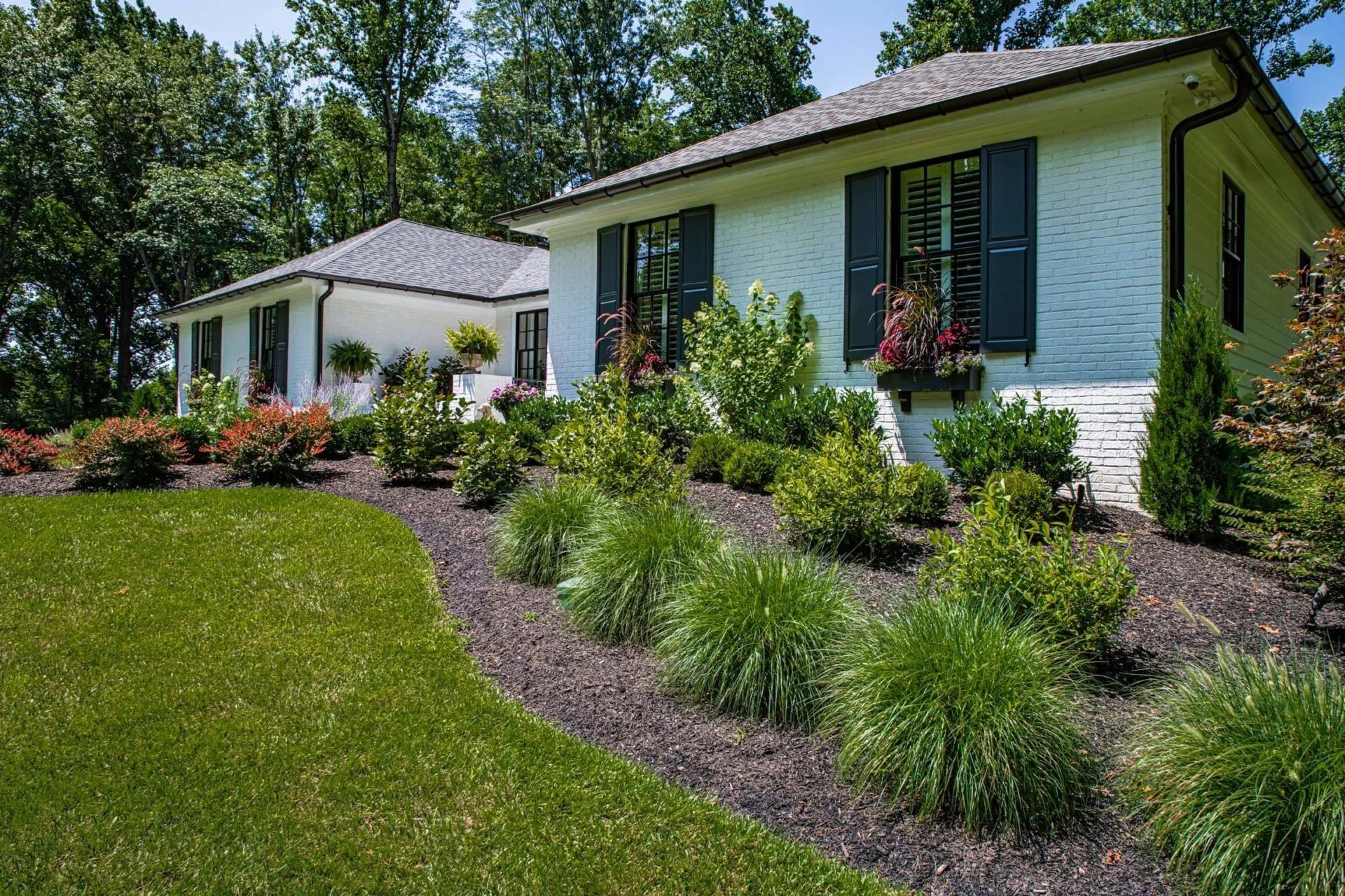 Front Of House Custom Landscaping by First Class Lawn Care