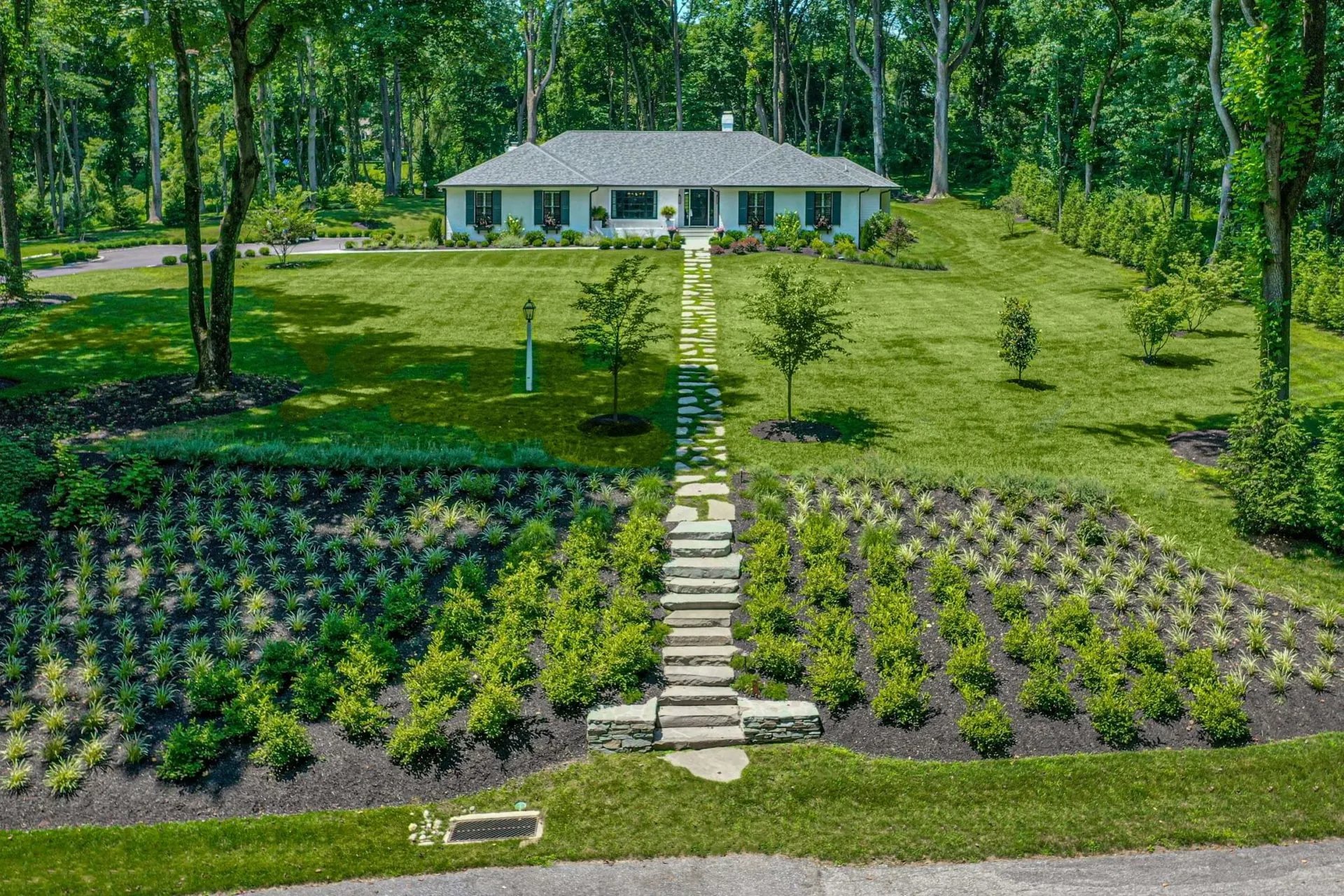 Landscaped Yard View From Road by First Class Lawn Care