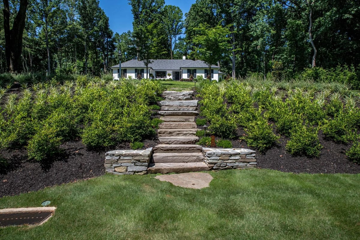 Stone Walkway In Landscaped Front Lawn by First Class Lawn Care