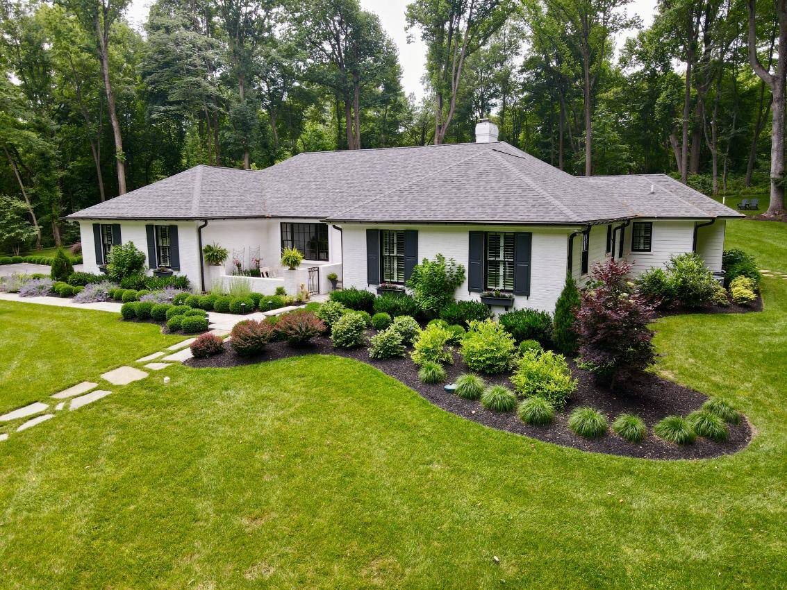 Side front exterior of hardscaping and landscaping done by First Class Lawn Care in Wilmington, DE