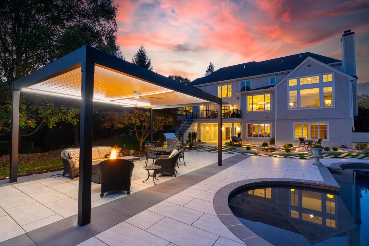 Outdoor lounge area with pergola and modern hardscape, hardscaping in West Chester, PA by First Class Lawn Care