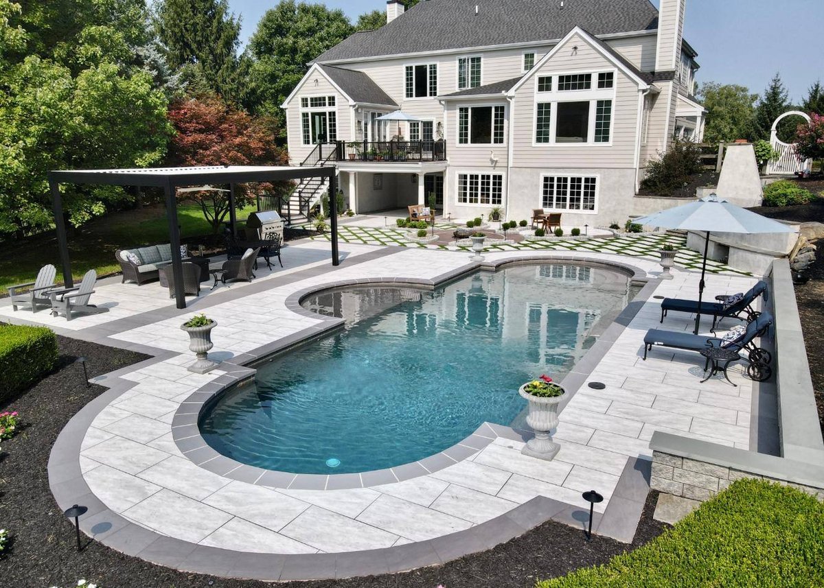 Pool area hardscaping by First Class Lawn Care in West Chester, PA